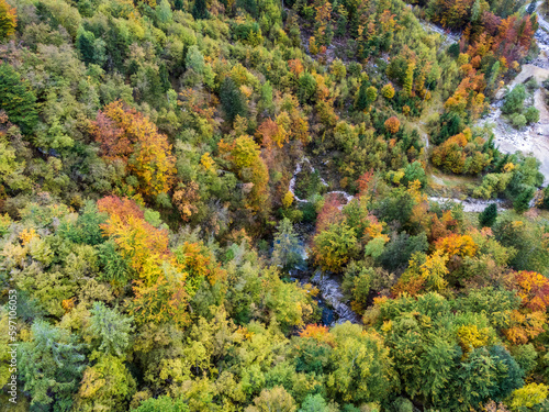 Autumn on the Karst waterfall of Fontanon di Goriuda. View from above.