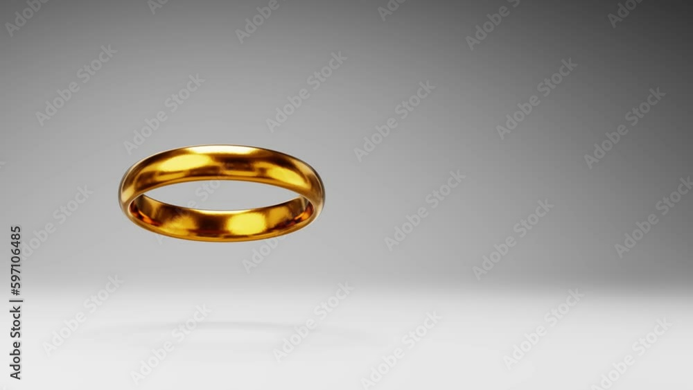 Golden Ring Spinning on a Studio Gray Background, Seamless Loop 3D Animation with Copy Space Golden Ring Spinning on a Studio Gray Background, Seamless Loop 3D Animation with Copy Space