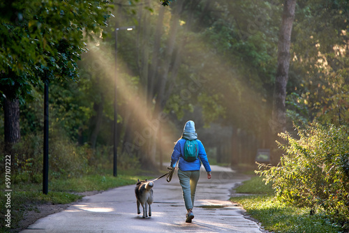 girl with dog on the walk