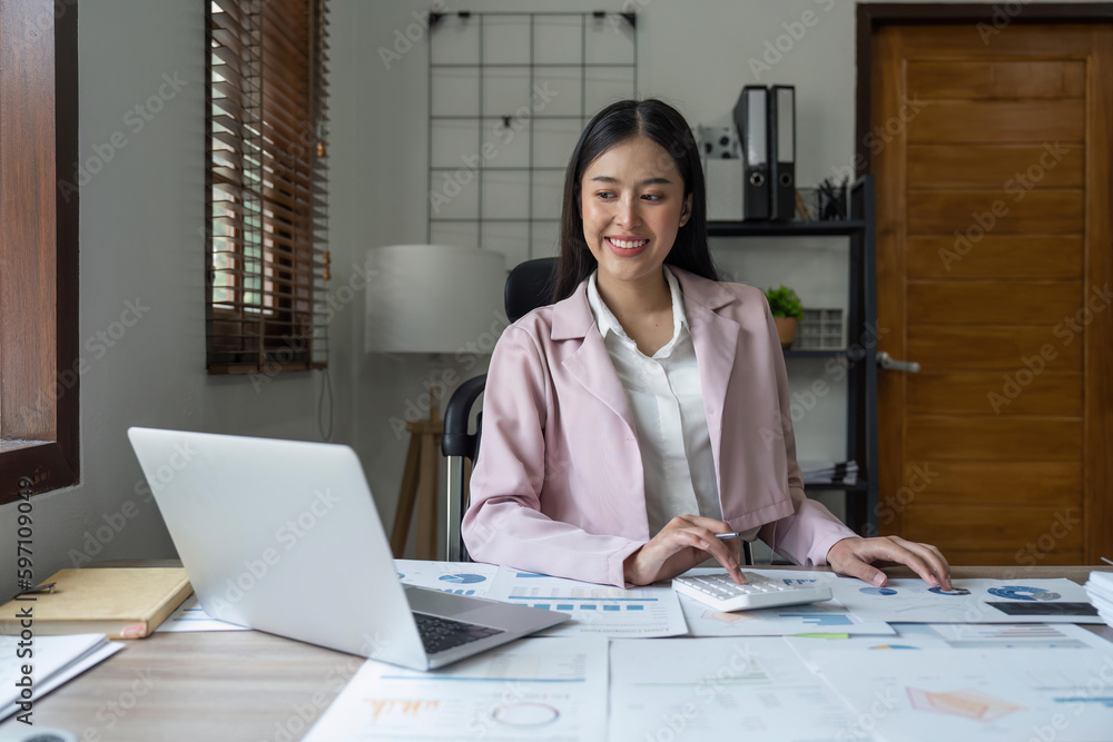 Asian business woman in the home office, doing planning analyzing the financial report, business plan investment Asian business woman in the home office, doing planning analyzing the financial report, business plan investment