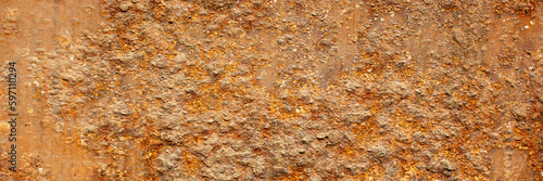 Rust of metals.Corrosive Rust on old iron with a hole. Rusted orange painted metal wall.