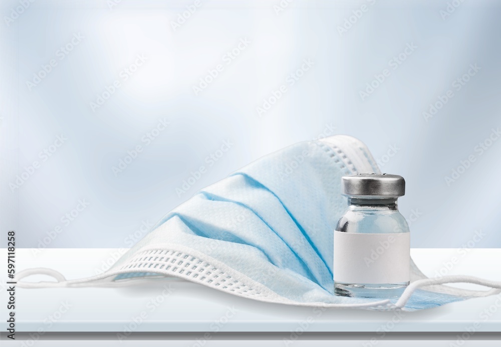 COVID-19 VACCINE ampoule bottle on the desk COVID-19 VACCINE ampoule bottle on the desk