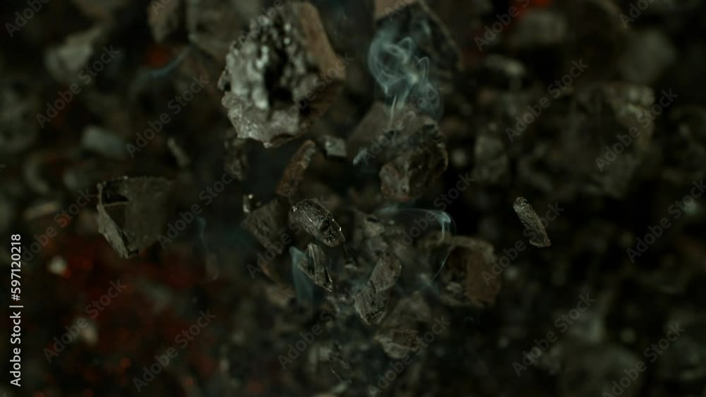 Super slow motion of rotating coal pieces with fire. Filmed on high speed cinema camera, 1000fps. Concept of fossil fuel burning and global warming problem. Speed ramp effect. Super slow motion of rotating coal pieces with fire. Filmed on high speed cinema camera, 1000fps. Concept of fossil fuel burning and global warming problem. Speed ramp effect.