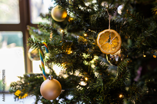 Homemade christmas tree decoration on plastic pine tree