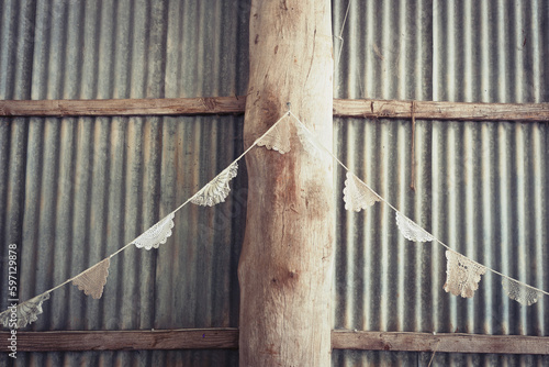 doily bunting in a rustic tin shed photo