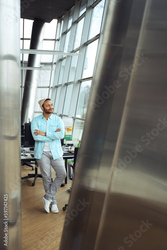 Man in headdress looking out window at job