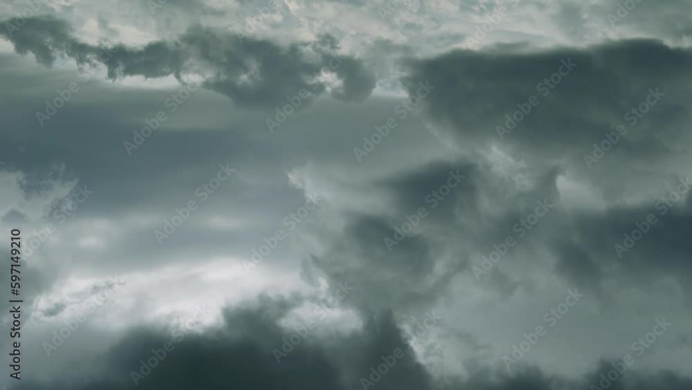 Dramatic Stormy Dark Sky in Sun Rays. Time Lapse Of Gray Black Clouds. Aerial Drone View, Airplane Window View. Beautiful Rainy Sky with Gray Cumulus Clouds in Sunlight. Beautiful Natural Background. Dramatic Stormy Dark Sky in Sun Rays. Time Lapse Of Gray Black Clouds. Aerial Drone View, Airplane Window View. Beautiful Rainy Sky with Gray Cumulus Clouds in Sunlight. Beautiful Natural Background.