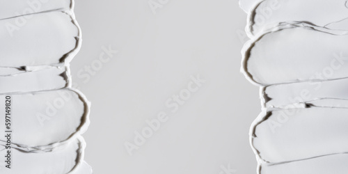 White moisturiser swatch banner. Beauty routine. Moisturising cream. Face lotion or mask texture macro. Skin care sample. Cosmetic smudge on grey background closeup. Sunscreen stroke. Copy space.