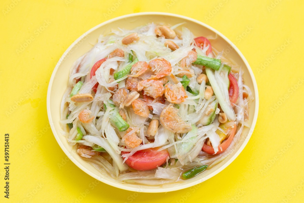 Dish of spicy papaya salad on white. Dish of spicy papaya salad on white.