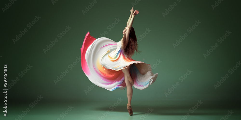 Portrait with one young woman, classic dancer dancing in colorful painted dress over dark green background. Contemporary dance style, ballet - obrazy, fototapety, plakaty 