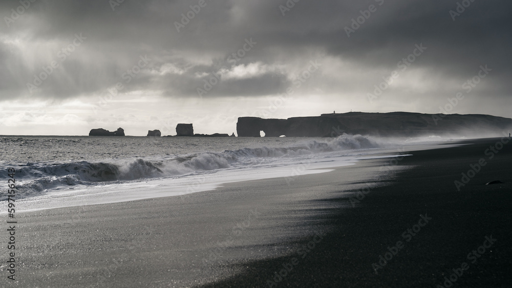 Reynisfjara Beach is one of the most stunning black sand beaches in Iceland is known for its towering basalt columns, dramatic cliffs, and powerful waves. Capture the beauty and drama