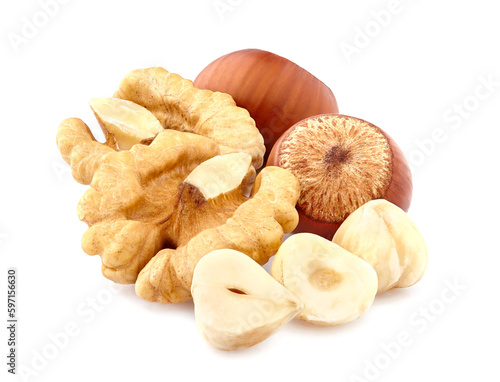 Hazelnuts with walnuts  in closeup isolated on white background. Nuts closeup.