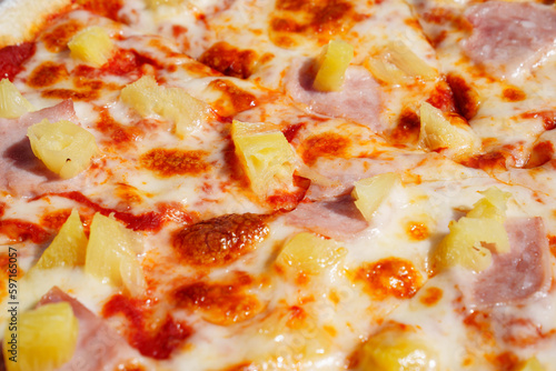 Pizza with pineapple and ham is a popular type of pizza known as Hawaiian pizza.