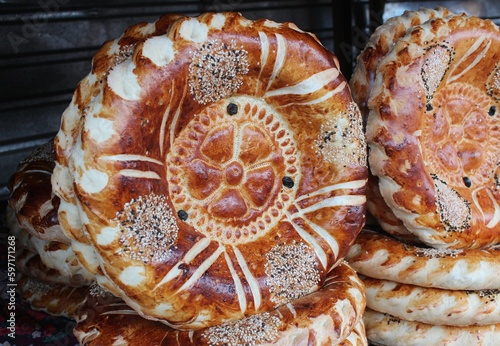 Local bread at the osh bazaar, local market in osh, kyrgyzstan photo