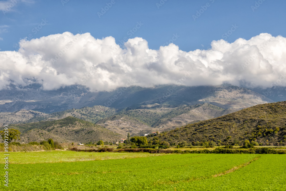 Beautiful mountain valley with gentle hills and clouds