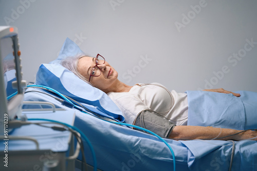 Woman is examined in a modern cardiology department photo