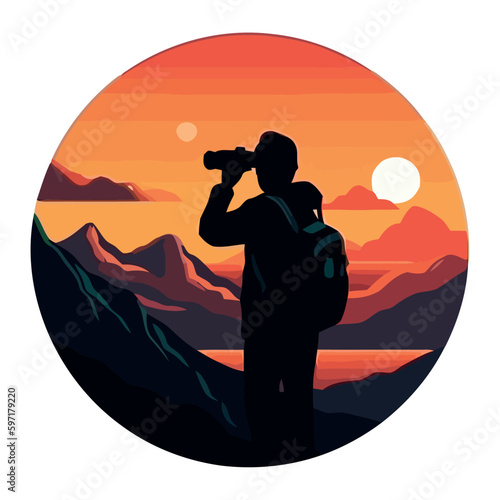 Silhouette of man watching sunset on mountain peak