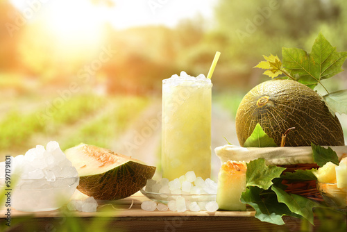 Natural melon drink with ice on wooden table in field photo