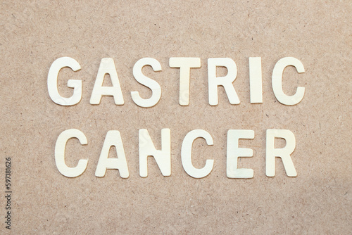 Wood alphabet letter in word gastric cancer on wood background