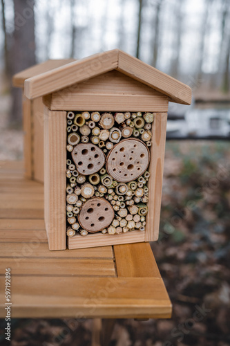 Handmade wooden insect house. Wooden insect hotel on table. Animal shelter.