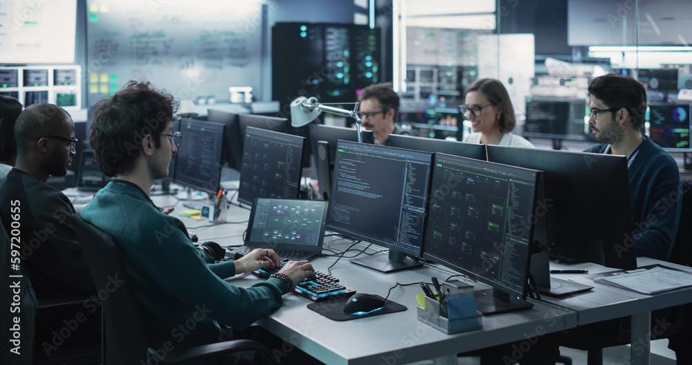 Group of Empowered Multicultural Men and Women Working in a Research Center, Using Computers to Run Advanced Software, Develop Artificial Intelligence Interface and Cyber Security Protocols Group of Empowered Multicultural Men and Women Working in a Research Center, Using Computers to Run Advanced Software, Develop Artificial Intelligence Interface and Cyber Security Protocols