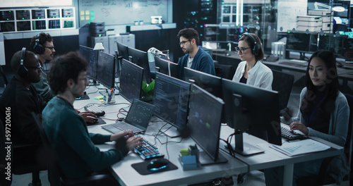 Naklejka Team of Six Diverse Multiethnic Software Developers Working on Computers, Programming Advanced Code, Managing Artificial Intelligence Projects Online for Innovative Internet Based Blockchain