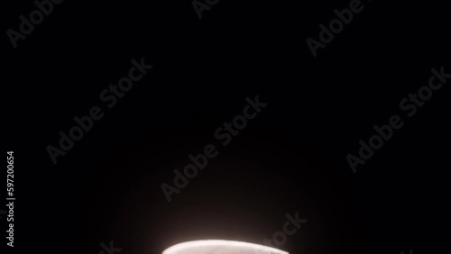 Coffee bean falling in slow motion. Cinematic close-up.