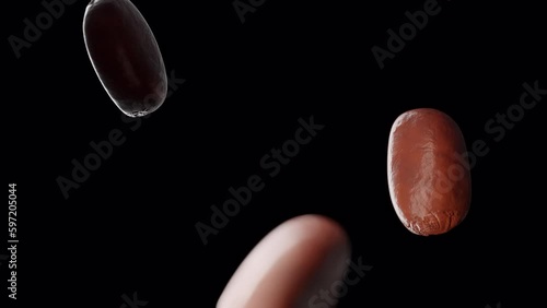 Coffee beans falling in slow motion. Cinematic close-up.