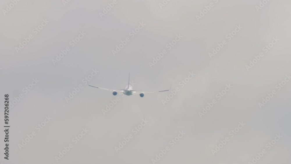 Long shot rear view of aircraft fly away, departure, take off. Tourism and travel concept, air flight. Long shot rear view of aircraft fly away, departure, take off. Tourism and travel concept, air flight.