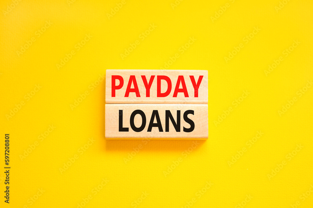Payday loans symbol. Concept words Payday loans on beautiful wooden block. Beautiful yellow table yellow background. Business and Payday loans concept. Copy space. Payday loans symbol. Concept words Payday loans on beautiful wooden block. Beautiful yellow table yellow background. Business and Payday loans concept. Copy space.