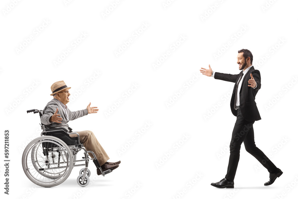 Businessman meeting an elderly man in a wheelchair Businessman meeting an elderly man in a wheelchair