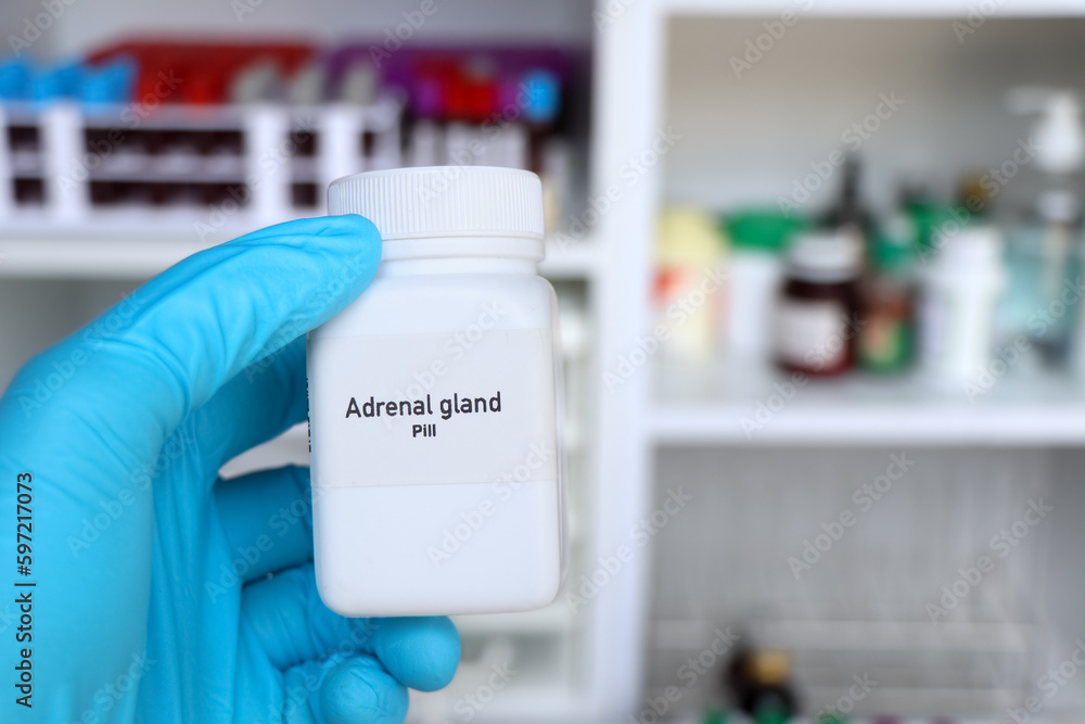 Adrenal gland pill in white bottle, pill stock