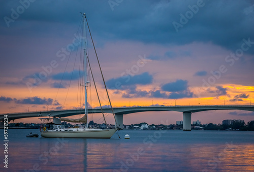 Sunset sky behind the John Ringling Causeway Bridge over Sarasota Bay in Sarasota Florida USA