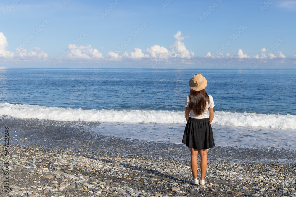 Travel woman go to the sea beach