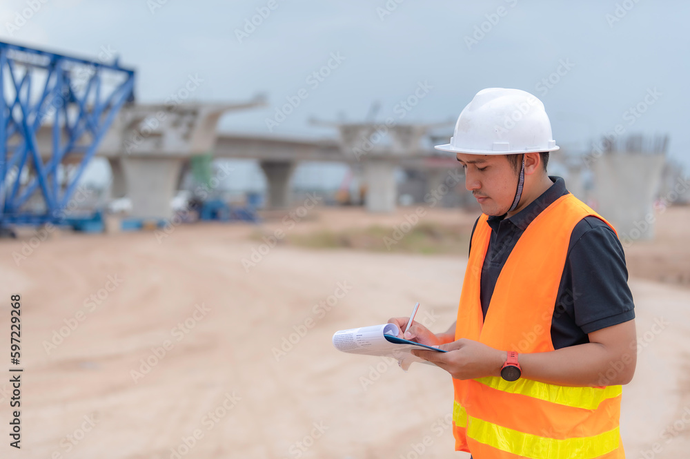Group of asian engineers discuss about work at site of building under construction,The contractor team discusses the design of the structure,Three workers are working outside. Group of asian engineers discuss about work at site of building under construction,The contractor team discusses the design of the structure,Three workers are working outside.
