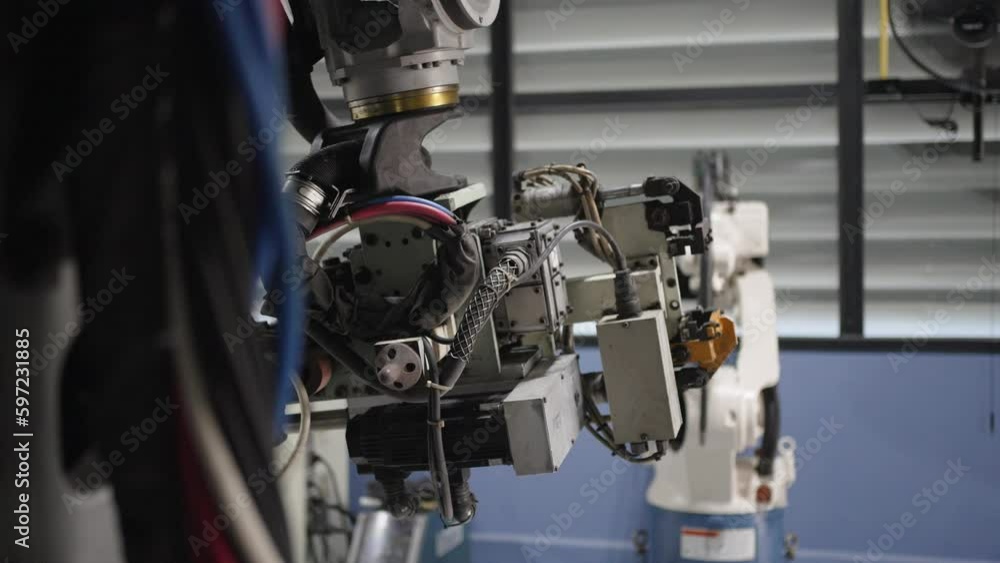 Engineer work at robotic arm factory. Engineer work at robotic arm factory.