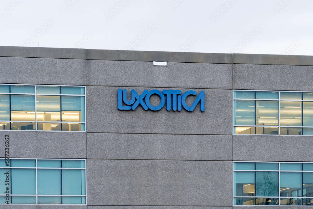 Luxottica logo sign on the headquarters building in Mason, OH, USA, December 28, 2021. Luxottica