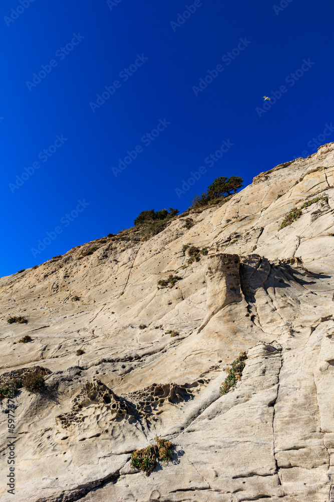 unusual rock formations of the volcanic cliff on Cala Sapone beach, quartz-trachitic ignimbrites. unusual rock formations of the volcanic cliff on Cala Sapone beach, quartz-trachitic ignimbrites.