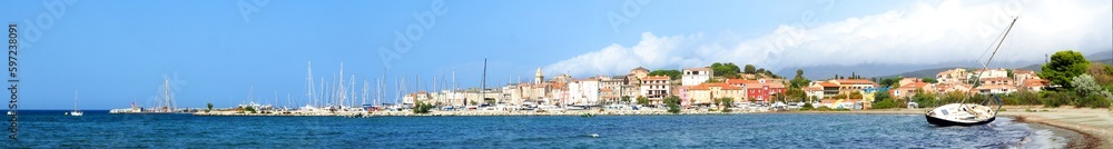 Panoramic view of the page and the marina of the famous seaside resort of Saint Florent, capital of the Nebbio region in Corsica, nicknamed the Island of Beauty