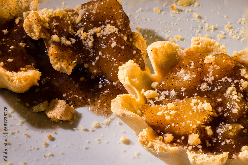100mm Macro of Apple Tartlets, small tarts, small pie, crumbs, shortbread crust and broken in pieces. 100mm Macro of Apple Tartlets, small tarts, small pie, crumbs, shortbread crust and broken in pieces.