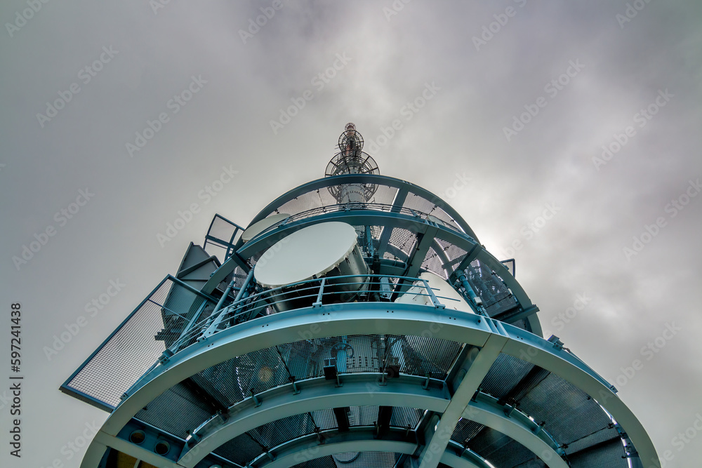 High angle view of Telecommunication tower with the background of thick clouds and copy space, on the top of mount Rigi, Switzerland. High angle view of Telecommunication tower with the background of thick clouds and copy space, on the top of mount Rigi, Switzerland.