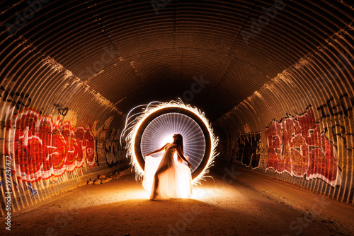 Sparkler Light Painting of a Beautiful Woman in a Storm Drain