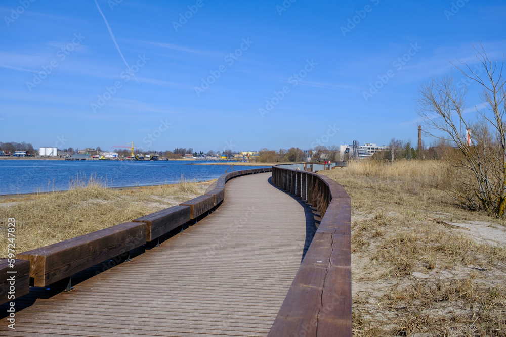 Parnu river wooden promenade along the river. New modern infrastructure for recreation.