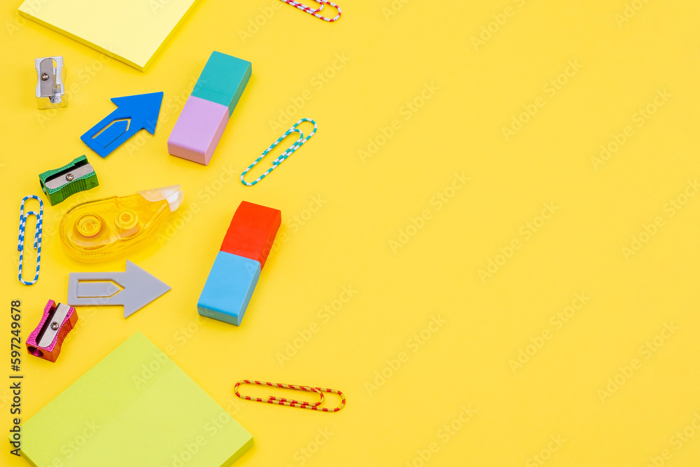 Stationery, paper clips, stickers on a yellow background as a concept of fun office work Stationery, paper clips, stickers on a yellow background as a concept of fun office work