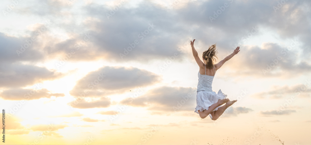 Happy beautiful young girl jumping