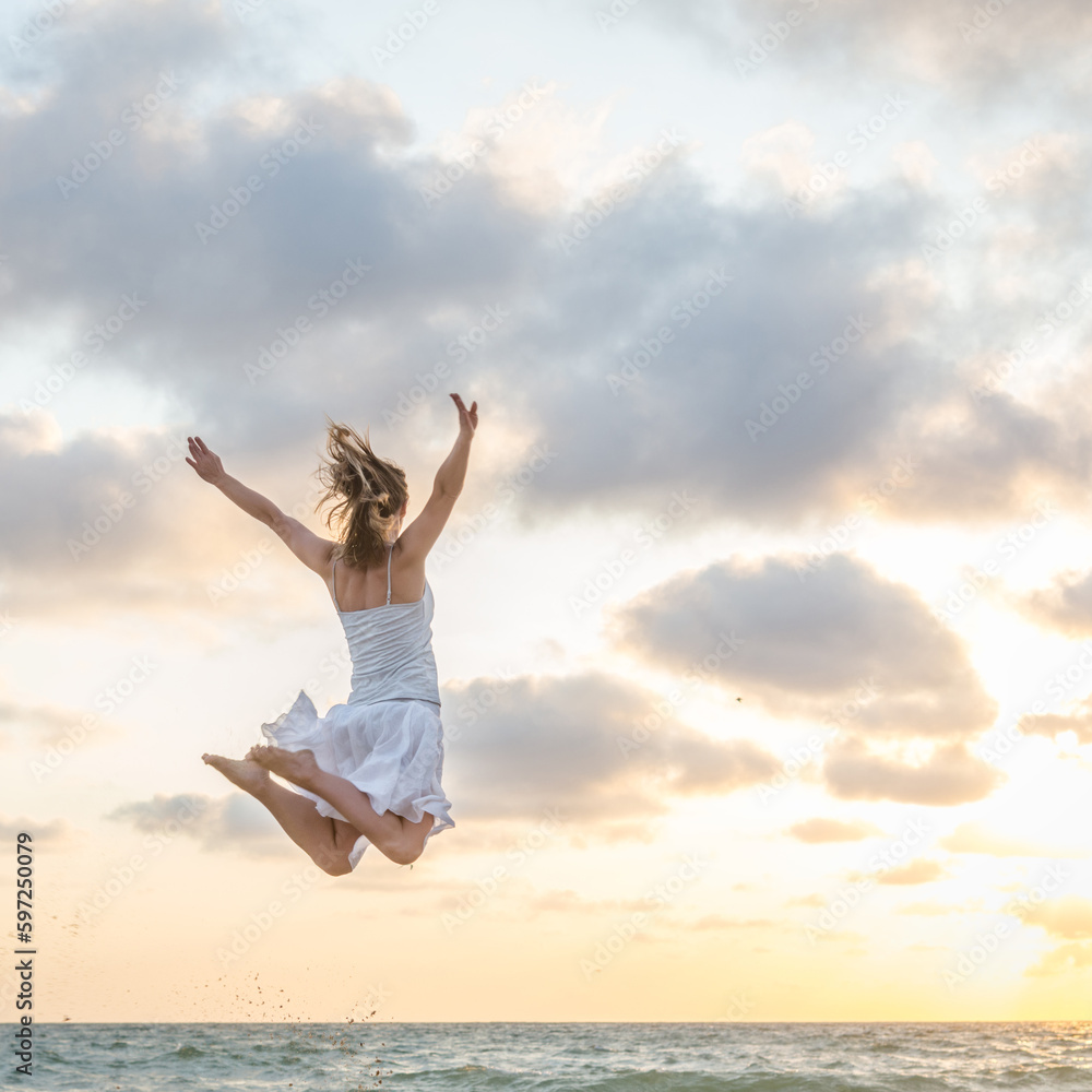 Happy beautiful young girl jumping Happy beautiful young girl jumping