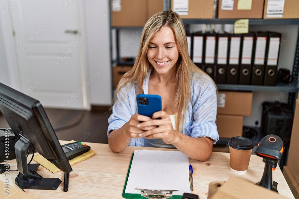 Young blonde woman ecommerce business worker using smartphone at office Young blonde woman ecommerce business worker using smartphone at office