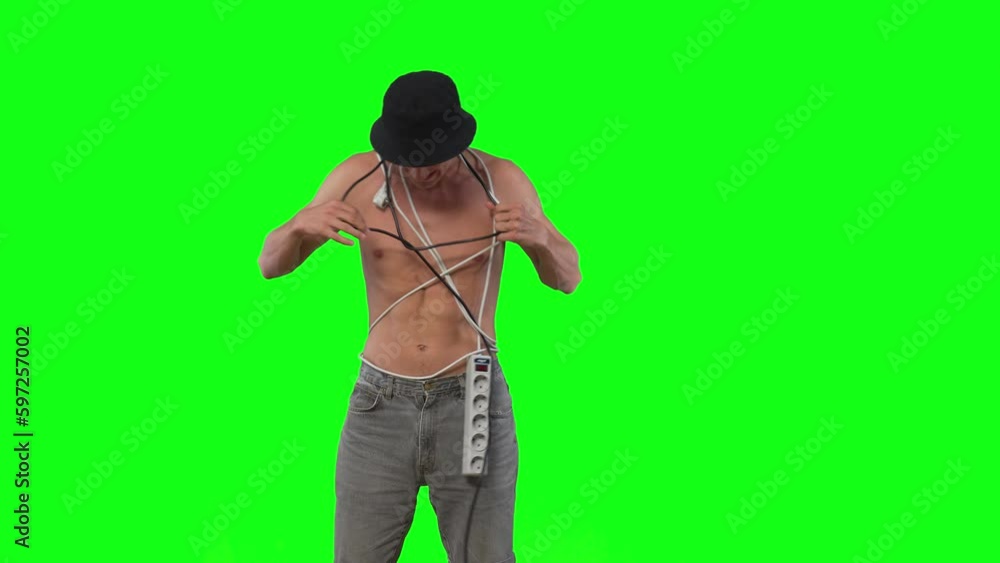 fun young guy got tangled in extension cords and tries to get out green screen fun young guy got tangled in extension cords and tries to get out green screen