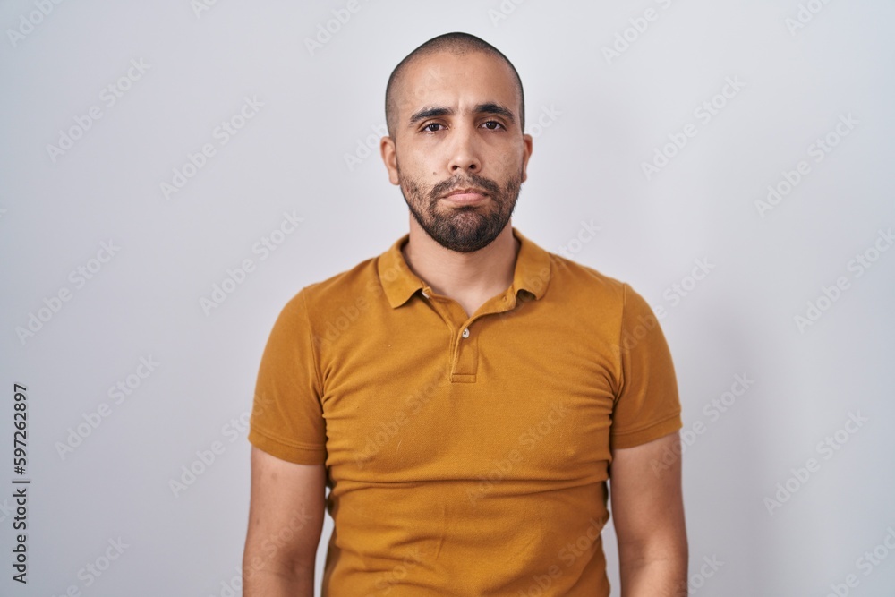 Hispanic man with beard standing over white background depressed and worry for distress, crying angry and afraid. sad expression. Hispanic man with beard standing over white background depressed and worry for distress, crying angry and afraid. sad expression.
