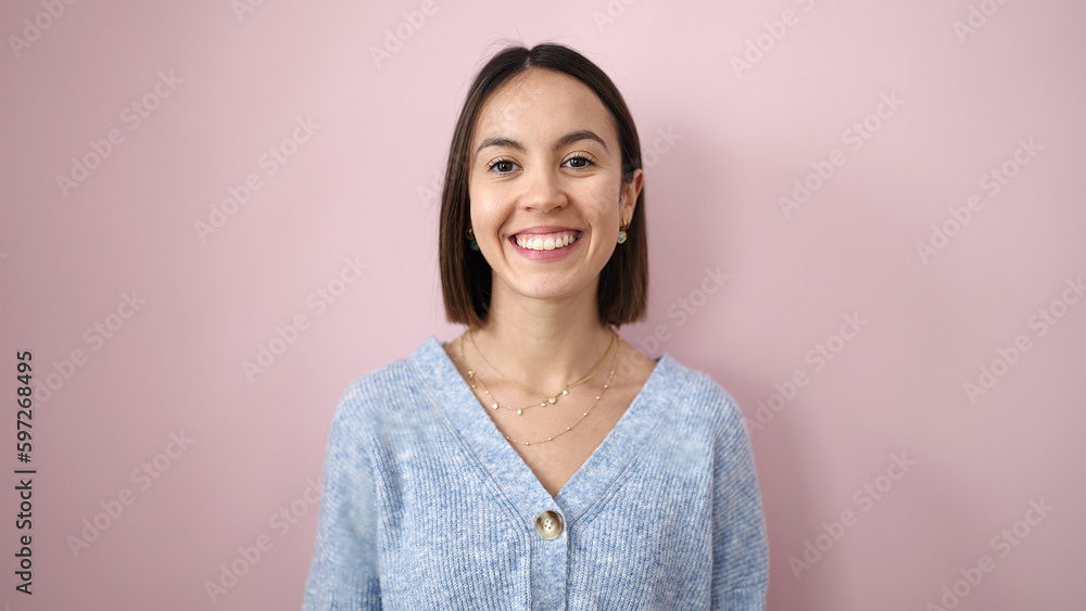 Young beautiful hispanic woman smiling confident standing over isolated pink background Young beautiful hispanic woman smiling confident standing over isolated pink background